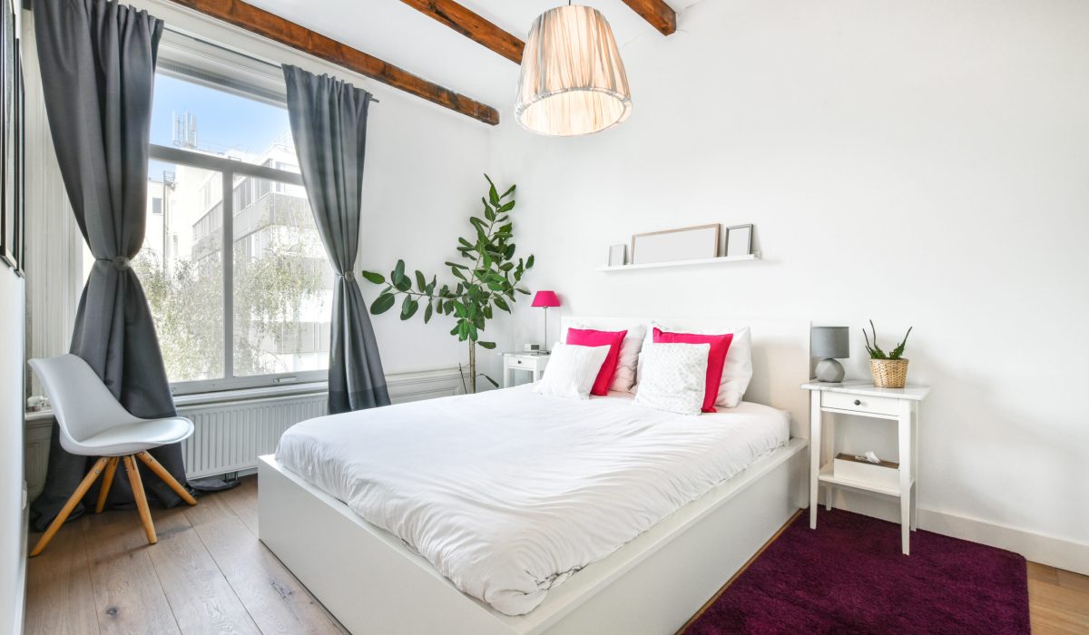 The cozy bedroom with comfortable furniture in a modern apartment